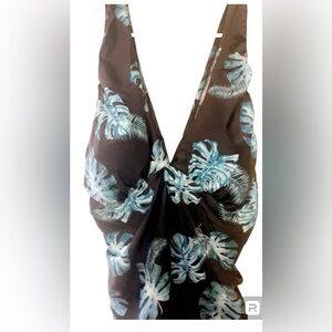 Swim suit. One piece size 5x. New with tag. Colors are black with teal green